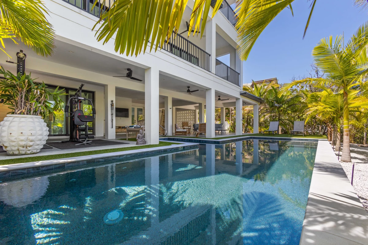 Pool reflections beside a modern coastal home photographed by Vuzario