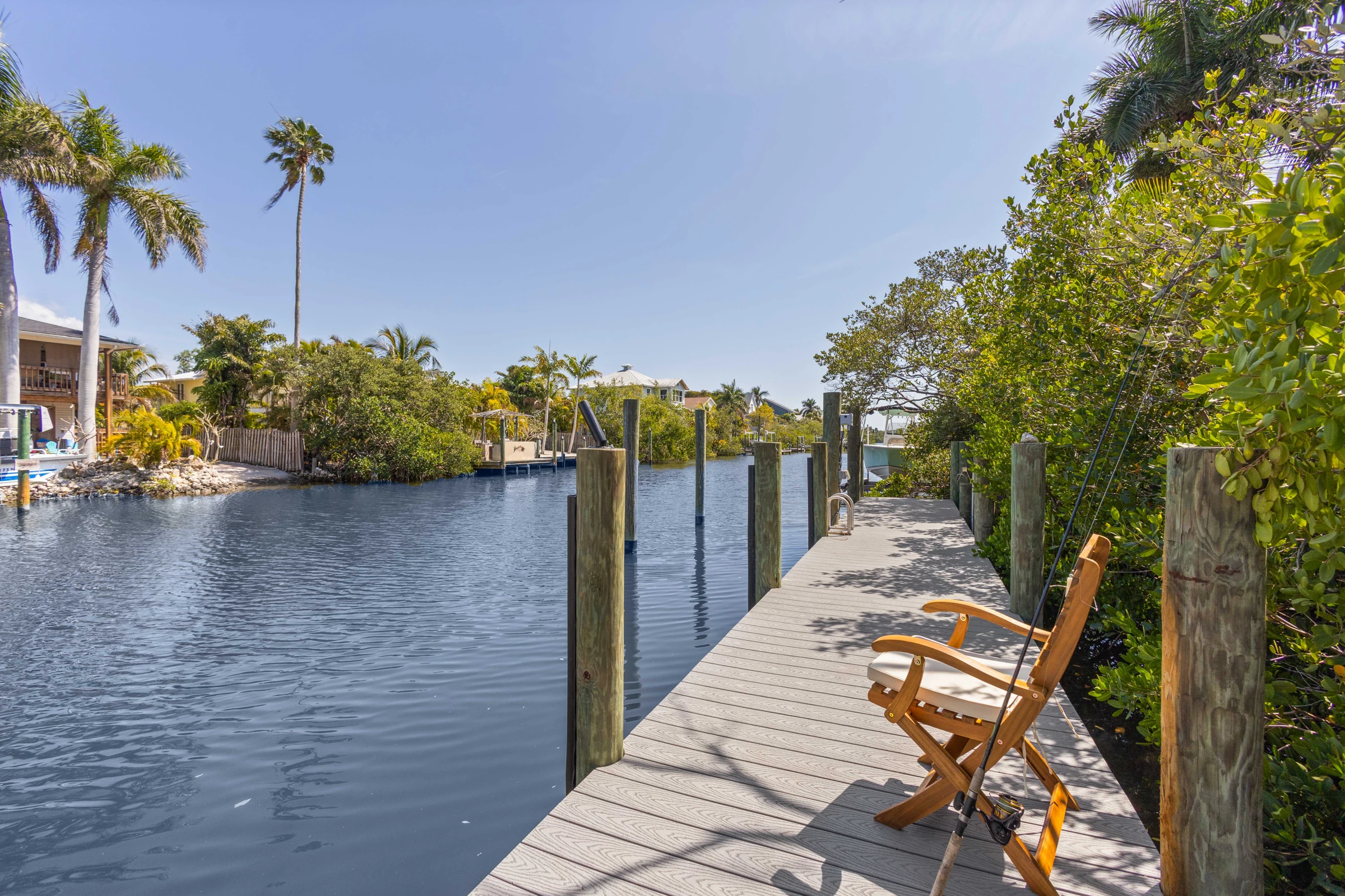 Peaceful canal-side dock and seating photographed by Vuzario