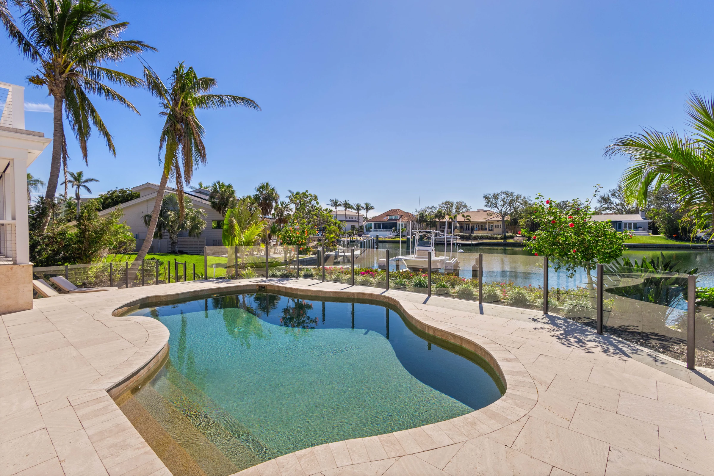 Pool terrace overlooking the waterfront photographed by Vuzario