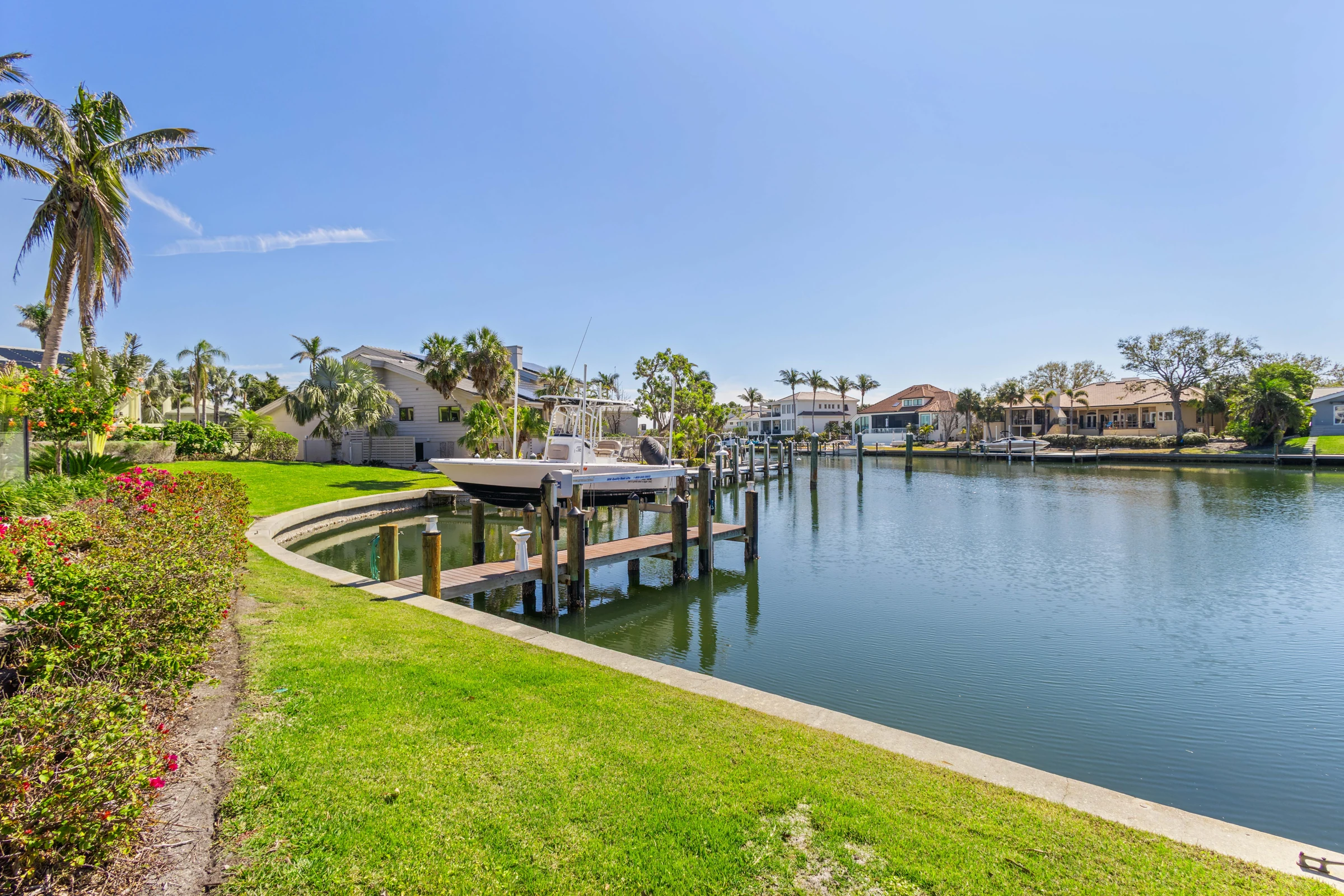Landscaped waterfront and private dock photographed by Vuzario