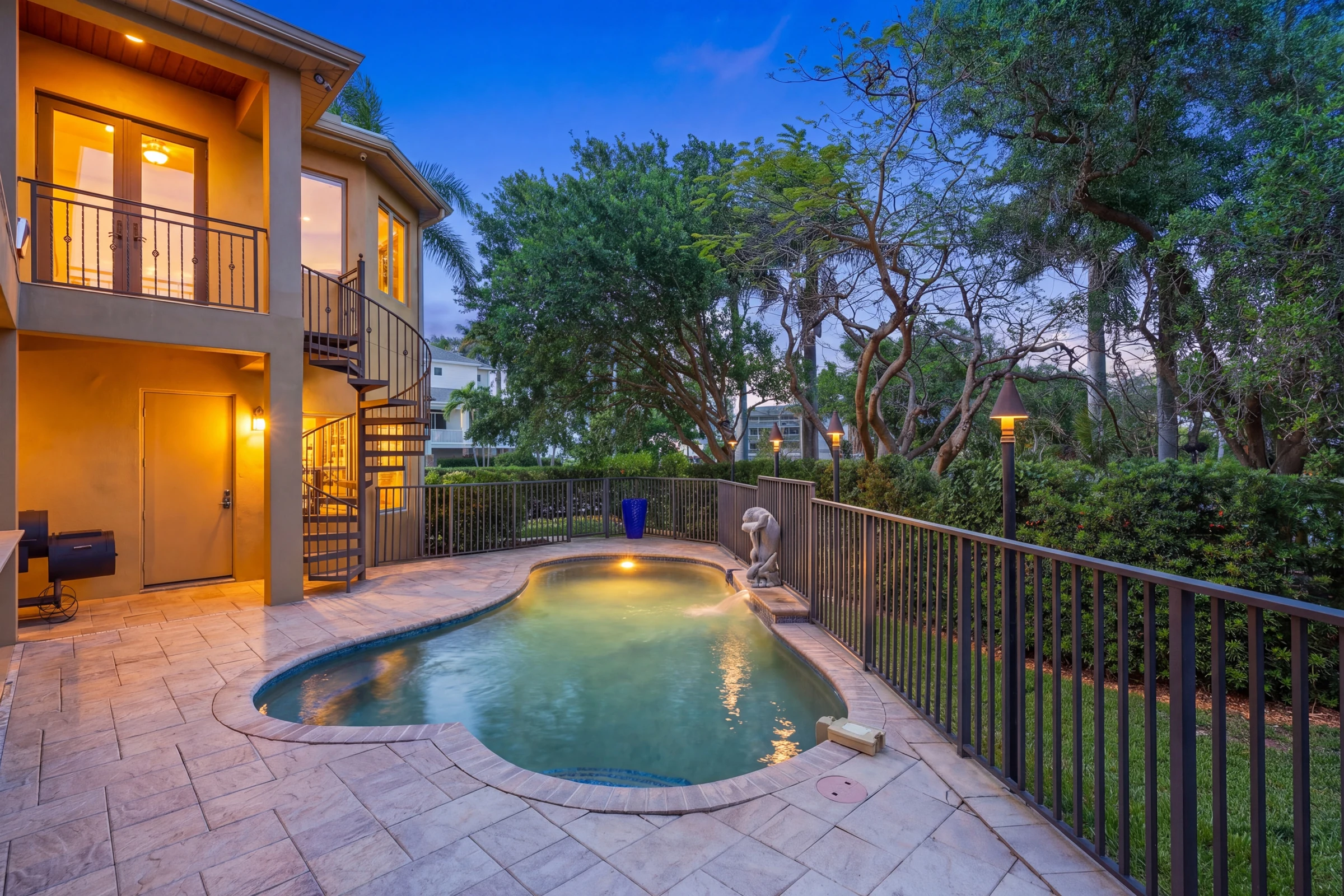 Evening pool nestled among the trees photographed by Vuzario