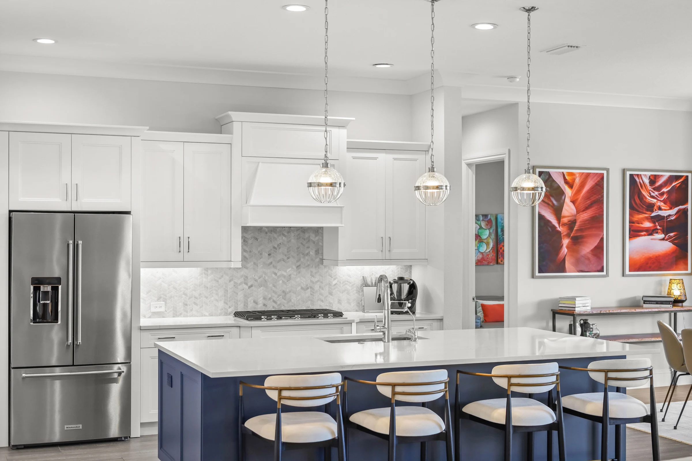 Contemporary kitchen and island seating photographed by Vuzario