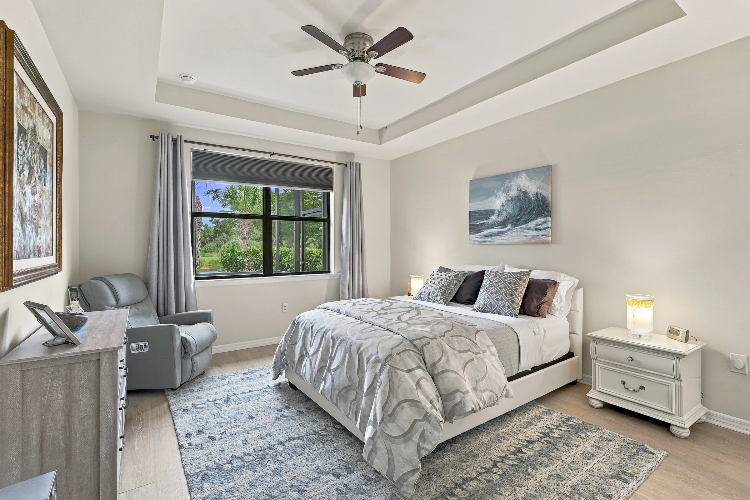 Light-filled primary bedroom photographed by Vuzario