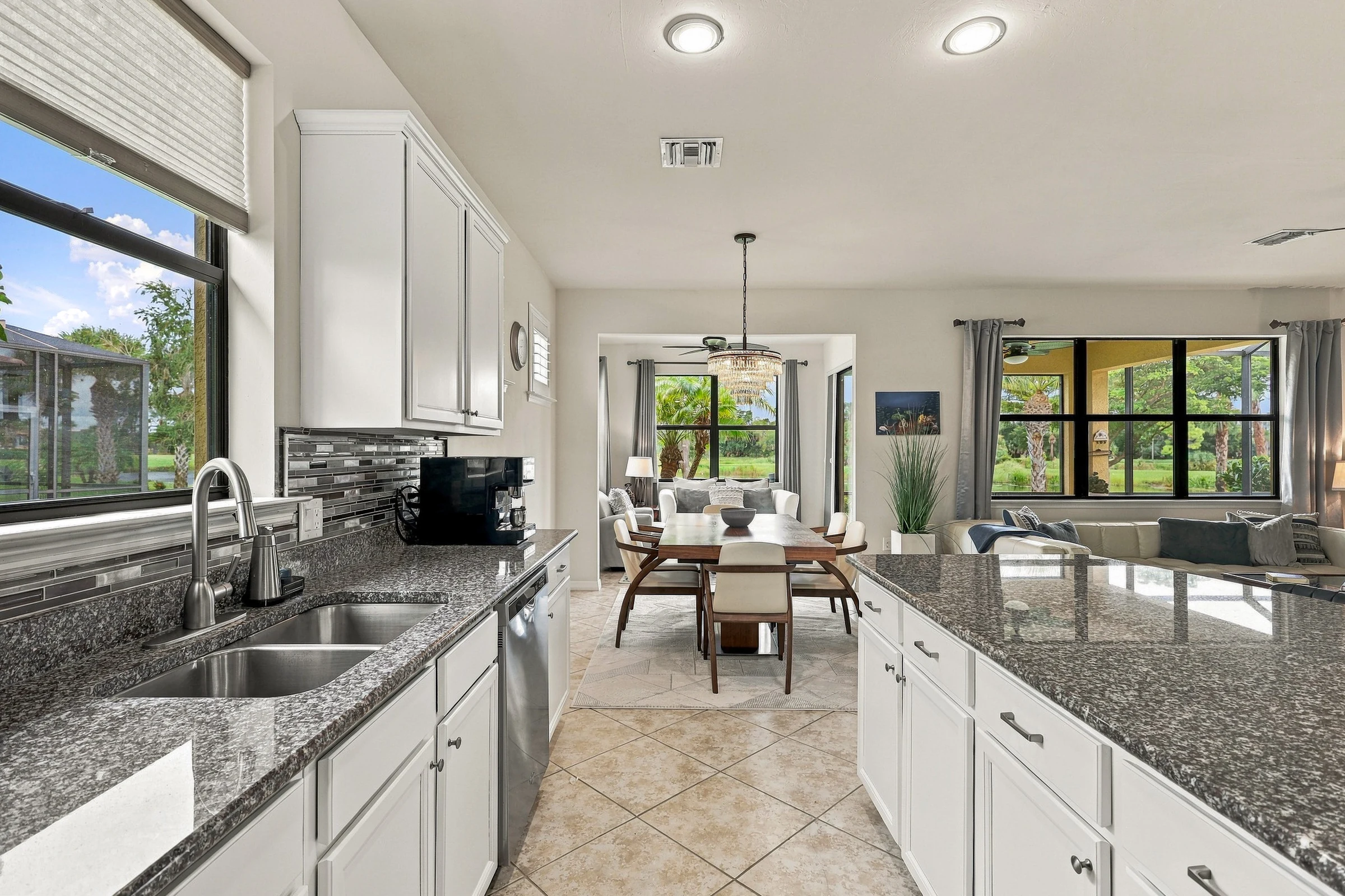 Kitchen opening into the living space photographed by Vuzario
